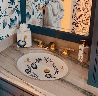 hand painted sink to coordinate with wallpaper and highlighted with metallic gold